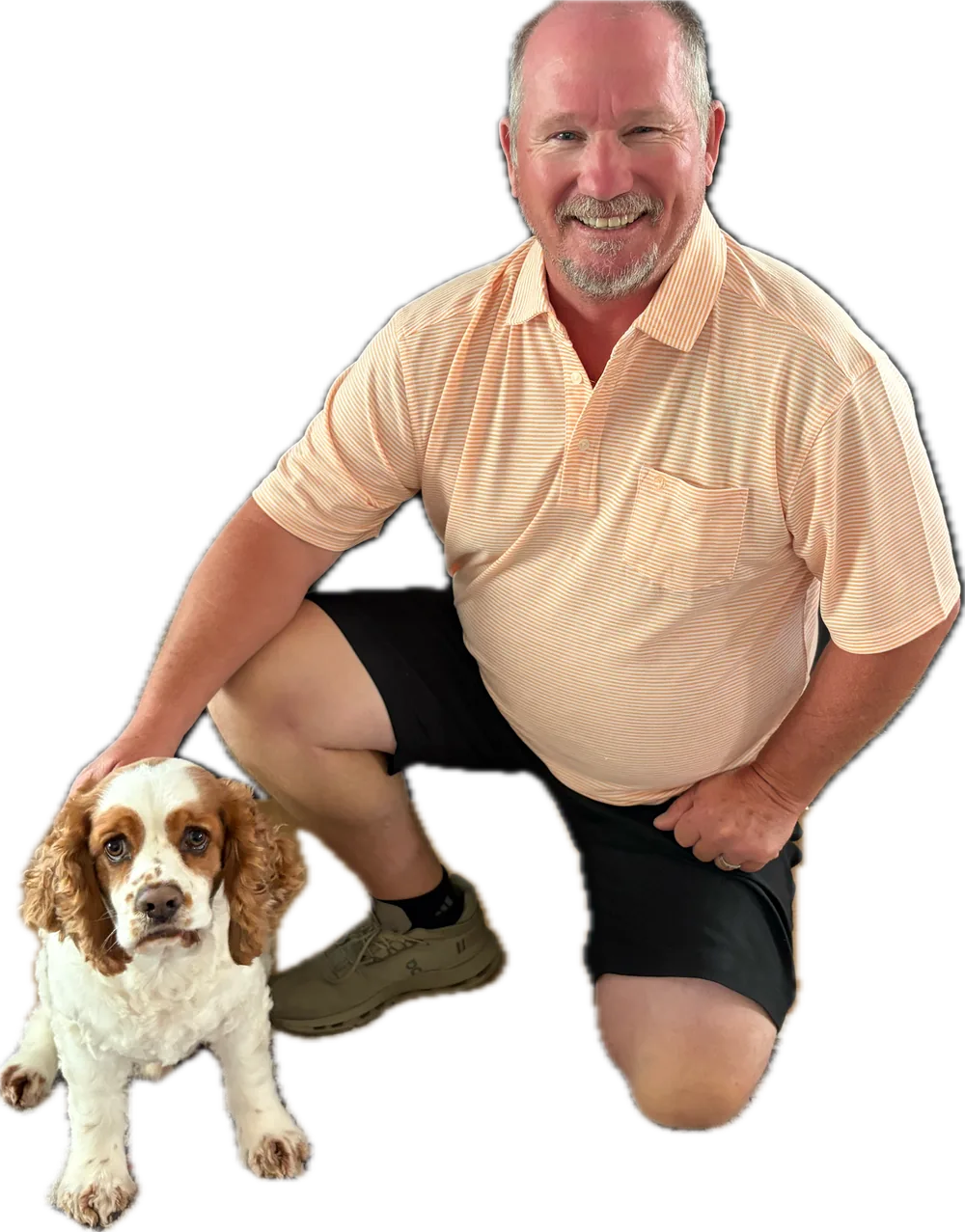 Brian Naylor, Owner and Operator of Integrity Cabinets and Installation, kneeling with his dog