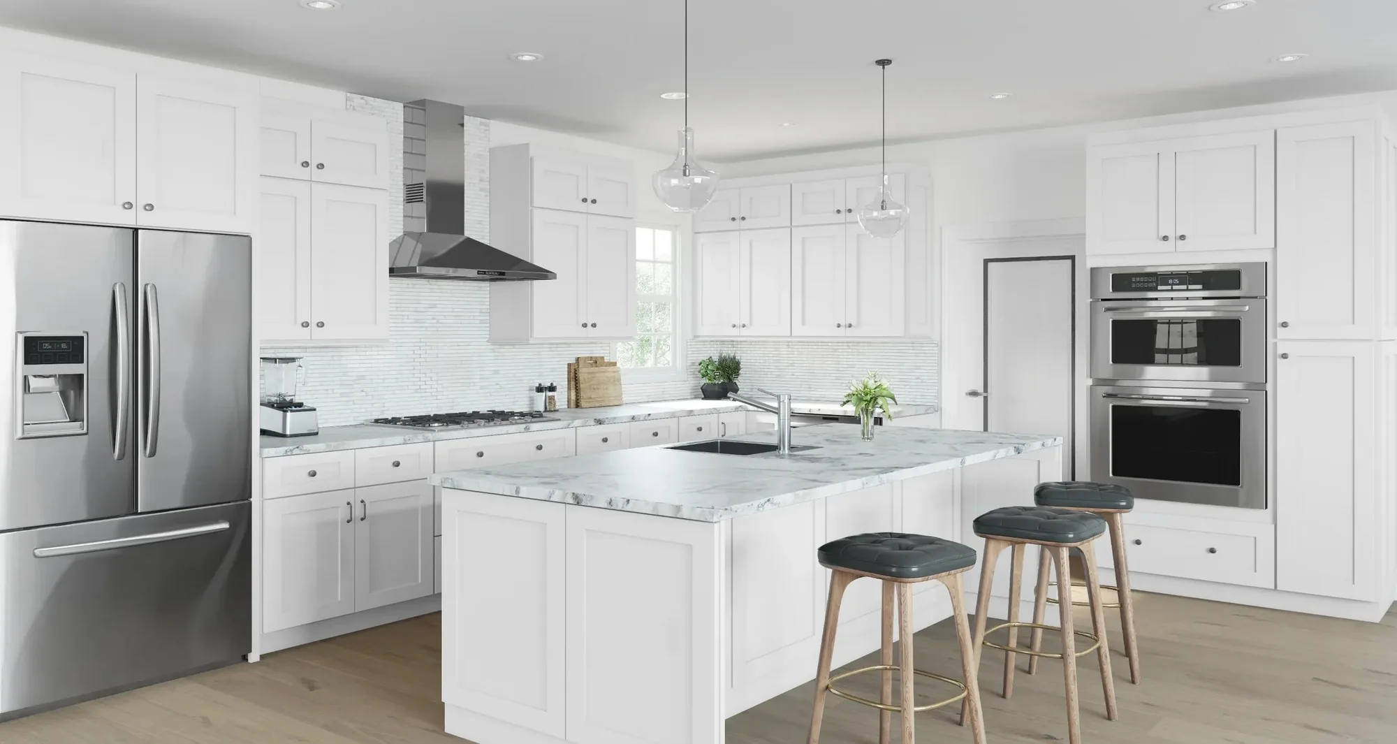 A white shaker kitchen with a marble island and stainless appliances